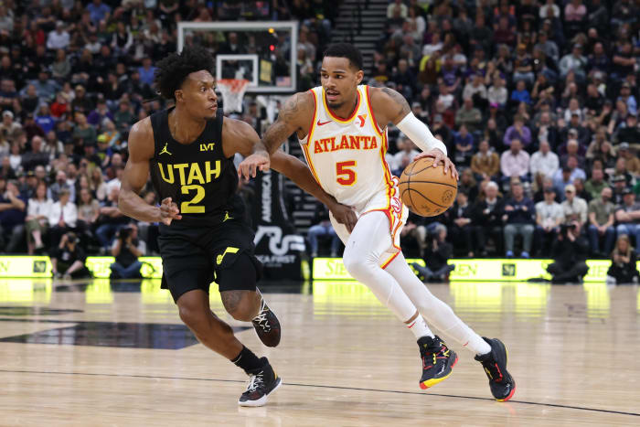 Mar 15, 2024; Salt Lake City, Utah, USA; Atlanta Hawks guard Dejounte Murray (5) drives against Utah Jazz guard Collin Sexton (2) during the second quarter at Delta Center. Mandatory Credit: Rob Gray-USA TODAY Sports